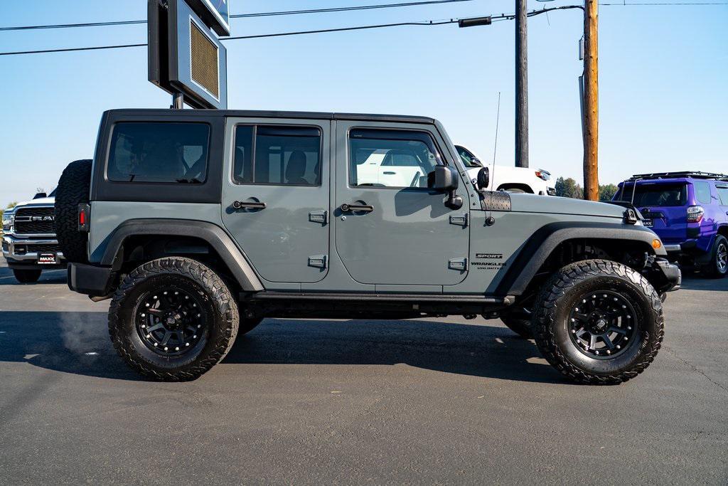 used 2014 Jeep Wrangler Unlimited car, priced at $21,697