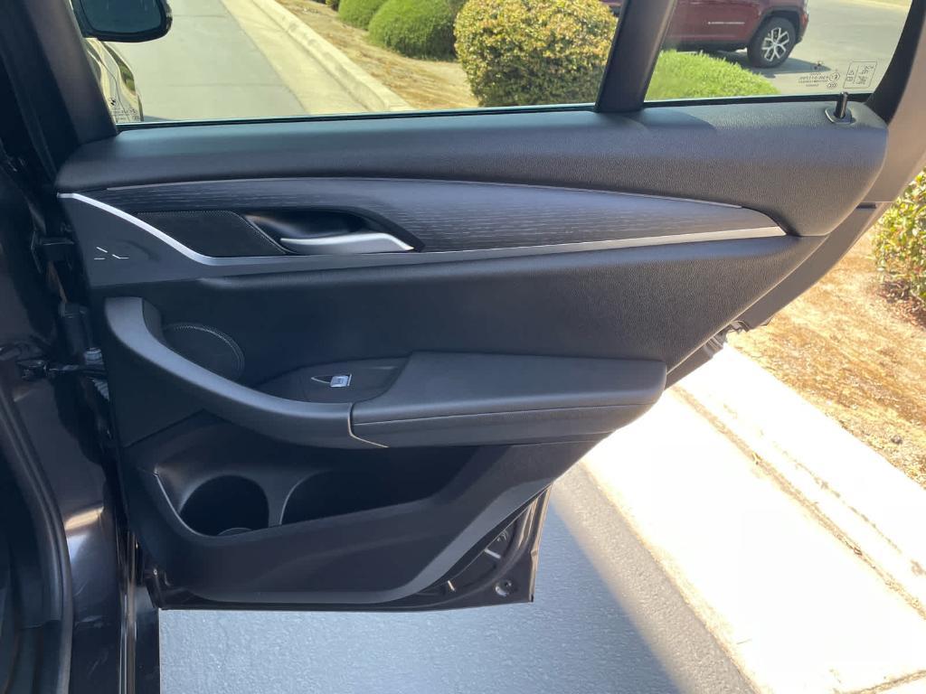 used 2023 BMW X4 car, priced at $44,999