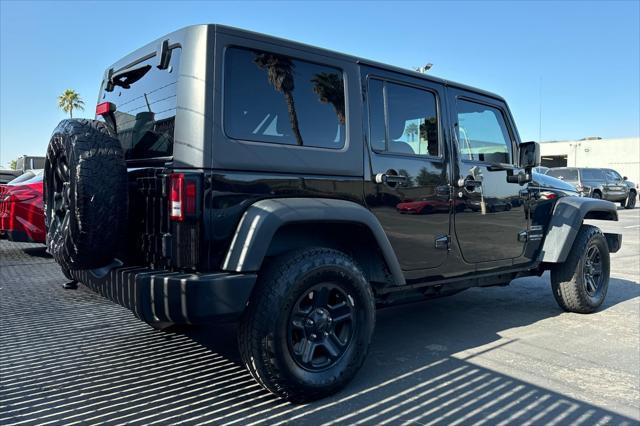 used 2015 Jeep Wrangler Unlimited car, priced at $16,299