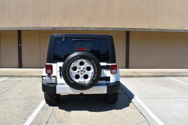 used 2013 Jeep Wrangler Unlimited car, priced at $18,988