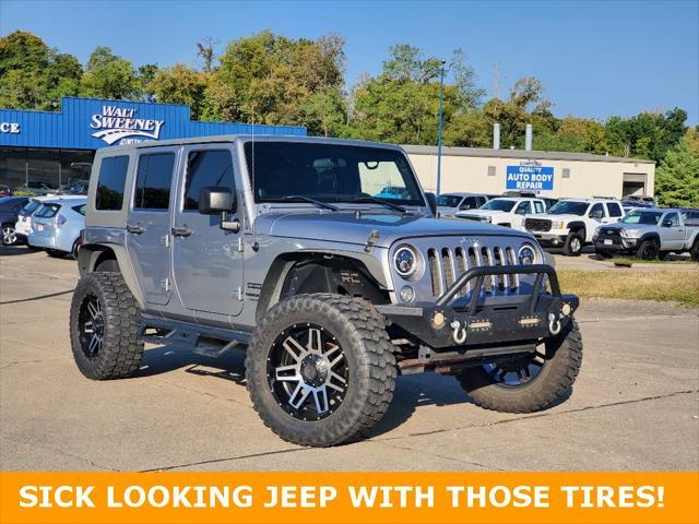 used 2014 Jeep Wrangler Unlimited car, priced at $19,695