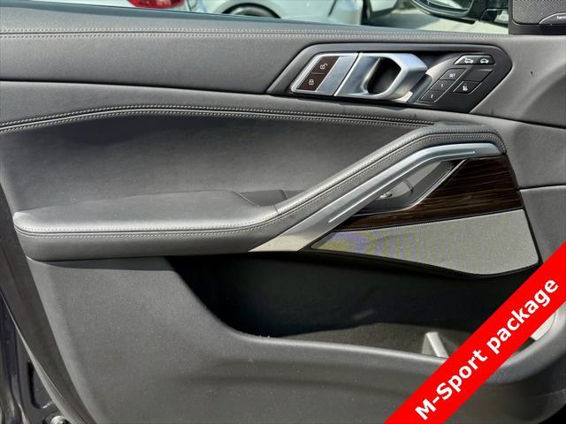 used 2025 BMW X6 car, priced at $56,595