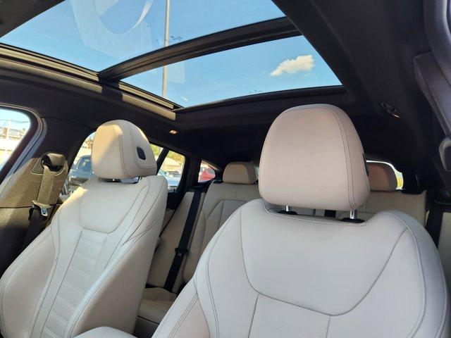 used 2022 BMW X4 car, priced at $34,944