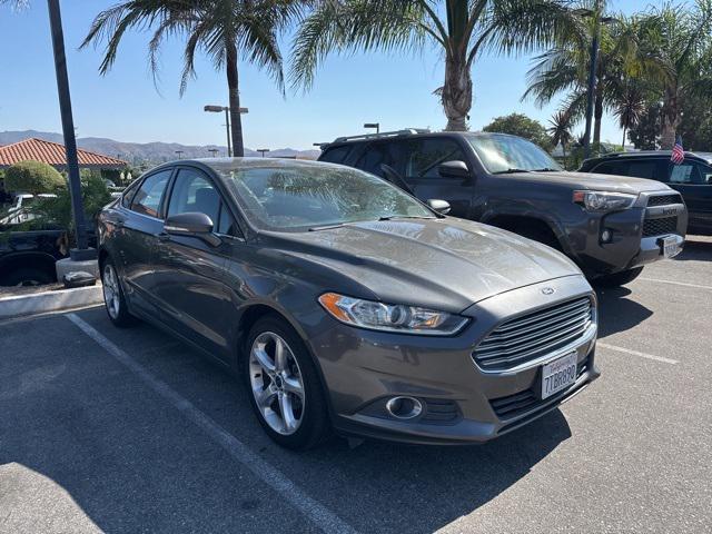 used 2016 Ford Fusion car, priced at $9,999