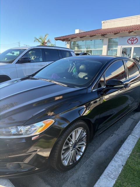 used 2016 Ford Fusion car, priced at $9,999