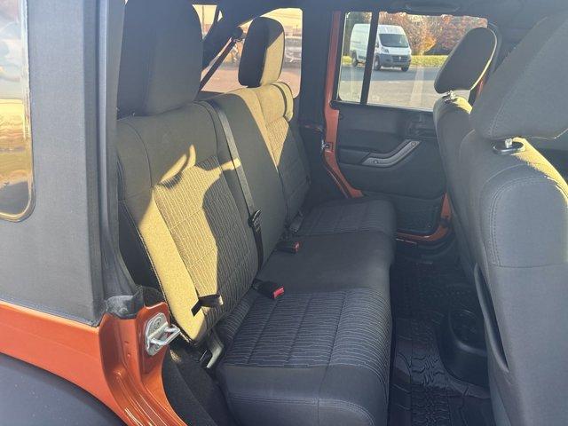 used 2011 Jeep Wrangler Unlimited car, priced at $14,390