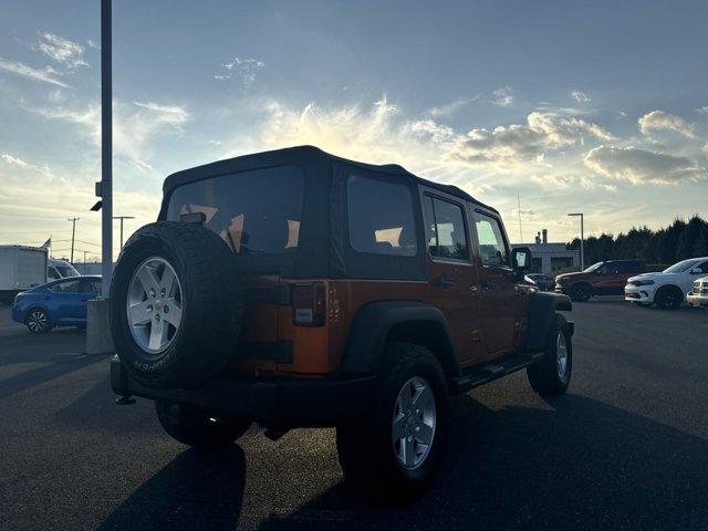 used 2011 Jeep Wrangler Unlimited car, priced at $14,390