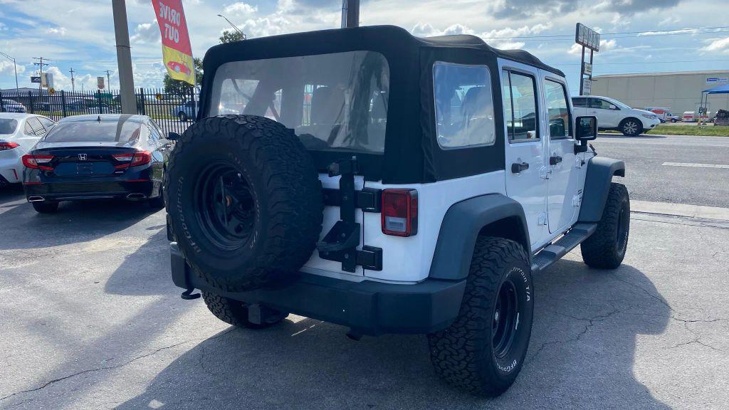 used 2014 Jeep Wrangler Unlimited car, priced at $14,499