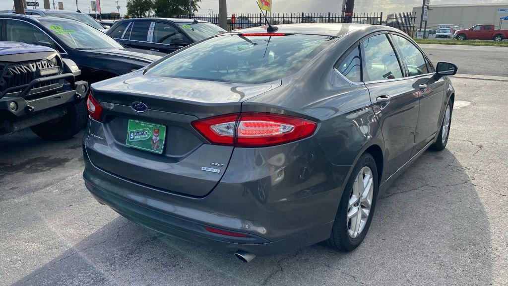 used 2014 Ford Fusion car, priced at $6,999