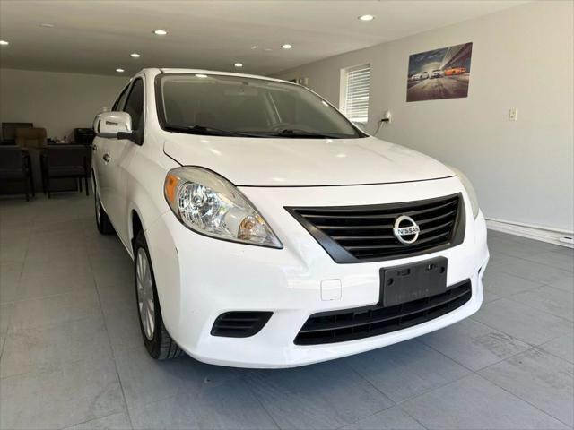 used 2014 Nissan Versa car, priced at $5,799