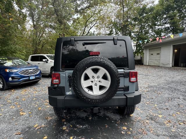 used 2014 Jeep Wrangler Unlimited car, priced at $19,988