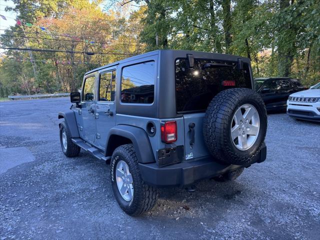 used 2014 Jeep Wrangler Unlimited car, priced at $16,988