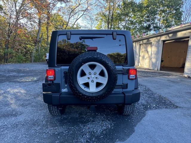 used 2014 Jeep Wrangler Unlimited car, priced at $16,988