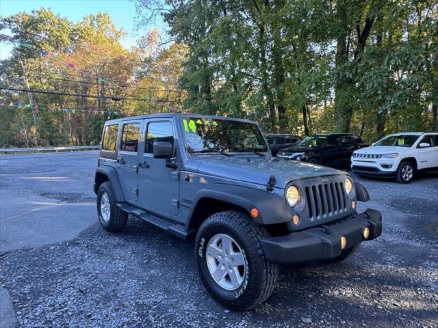 used 2014 Jeep Wrangler Unlimited car, priced at $16,988