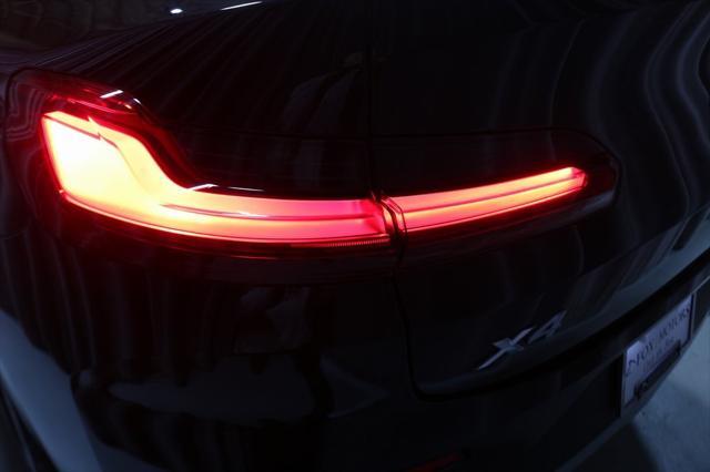 used 2025 BMW X4 car, priced at $52,500