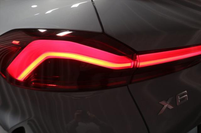 new 2025 BMW X6 car, priced at $87,930