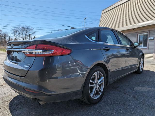 used 2018 Ford Fusion car, priced at $13,595