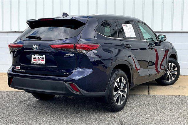 used 2021 Toyota Highlander Hybrid car, priced at $28,750