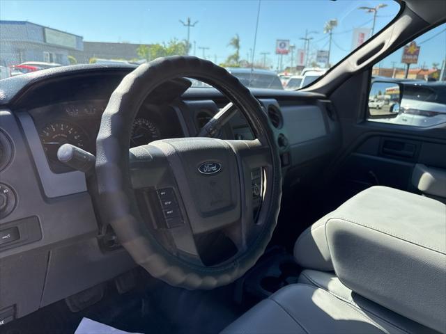 used 2014 Ford F-150 car, priced at $14,000