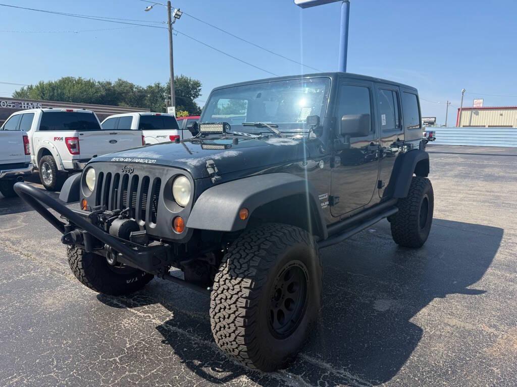 used 2013 Jeep Wrangler Unlimited car, priced at $13,988