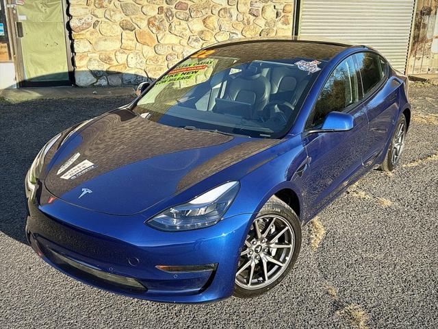 used 2022 Tesla Model 3 car, priced at $27,995