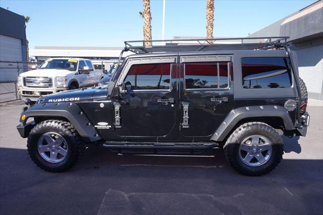 used 2011 Jeep Wrangler Unlimited car, priced at $13,998