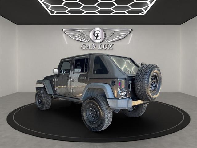 used 2018 Jeep Wrangler JK Unlimited car, priced at $18,989