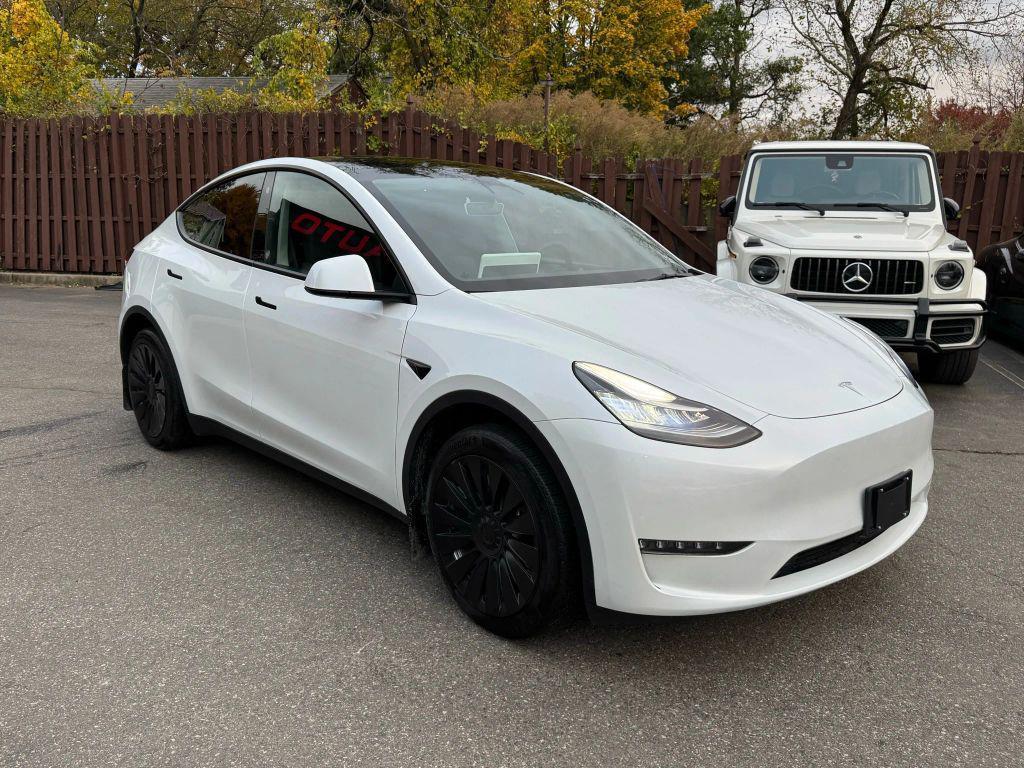 used 2023 Tesla Model Y car, priced at $31,000