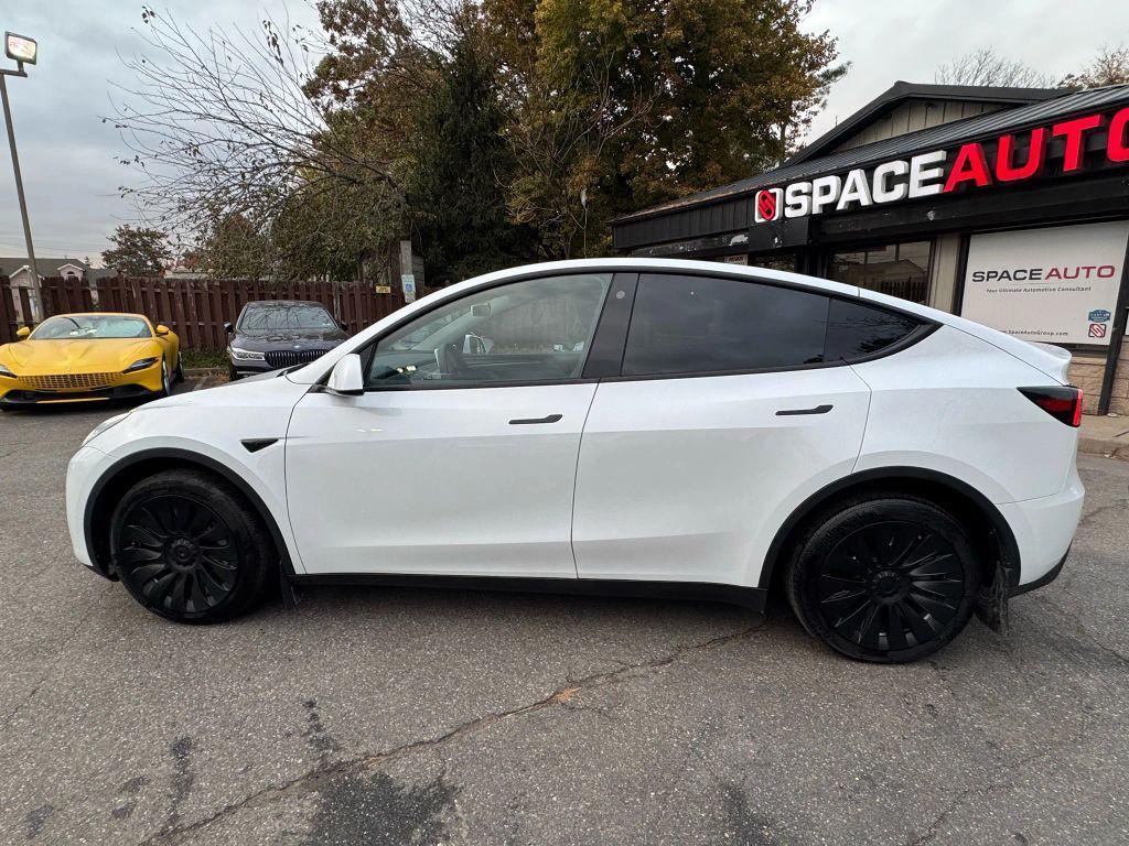 used 2023 Tesla Model Y car, priced at $31,000