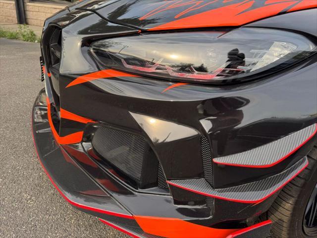 used 2023 BMW M4 car, priced at $84,980