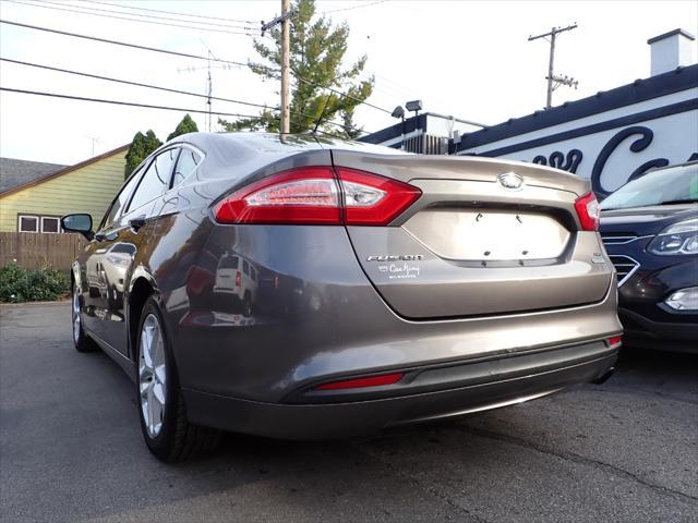 used 2014 Ford Fusion car, priced at $6,999