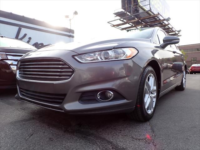 used 2014 Ford Fusion car, priced at $6,999