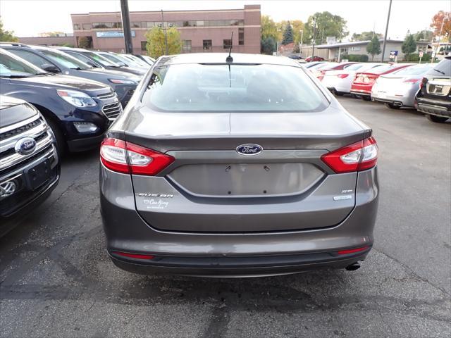 used 2014 Ford Fusion car, priced at $6,999