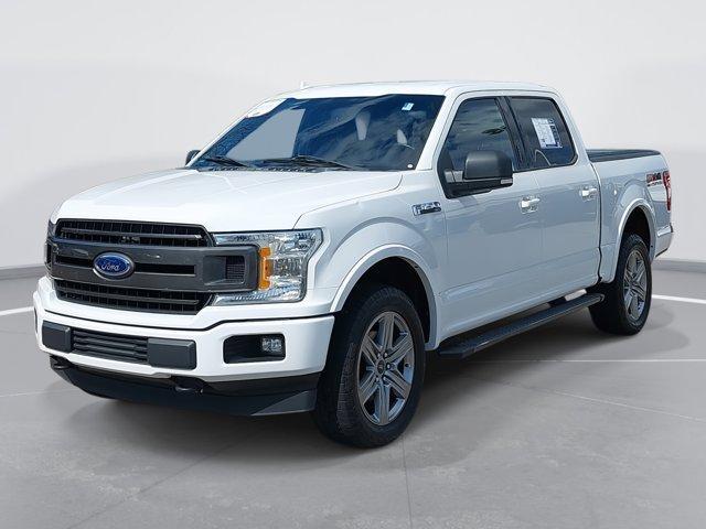 used 2018 Ford F-150 car, priced at $19,288