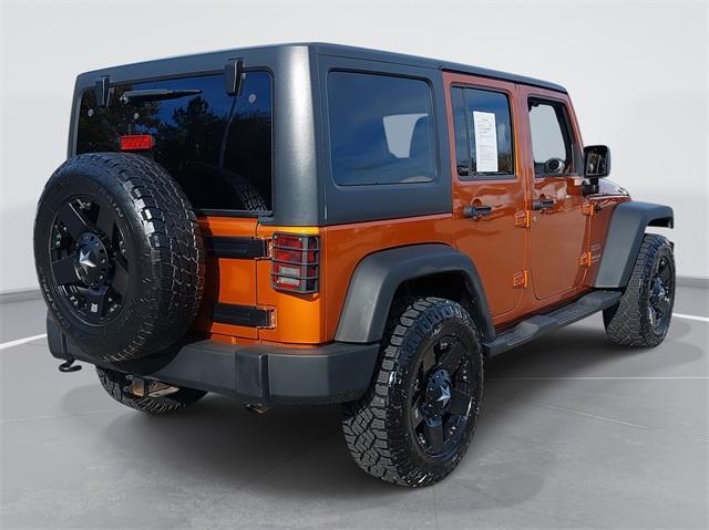 used 2011 Jeep Wrangler Unlimited car, priced at $13,477