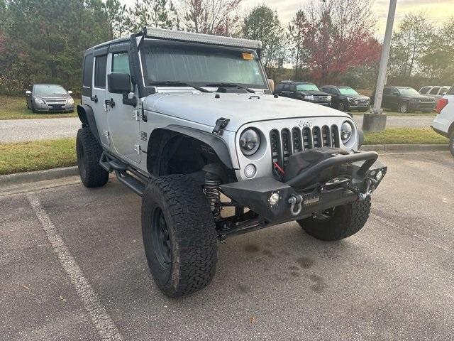 used 2011 Jeep Wrangler Unlimited car, priced at $16,984