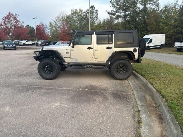 used 2011 Jeep Wrangler Unlimited car, priced at $16,984