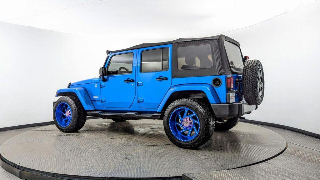 used 2015 Jeep Wrangler Unlimited car, priced at $16,897