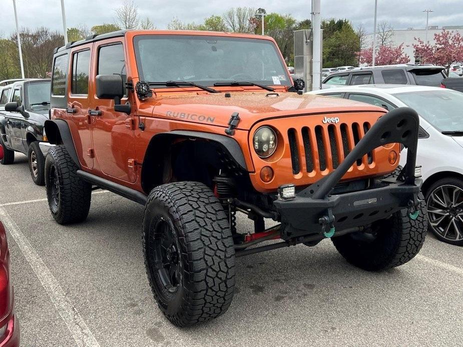 used 2011 Jeep Wrangler Unlimited car, priced at $14,335