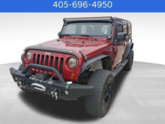 used 2013 Jeep Wrangler Unlimited car, priced at $15,570
