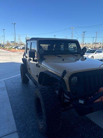 used 2014 Jeep Wrangler Unlimited car, priced at $17,474