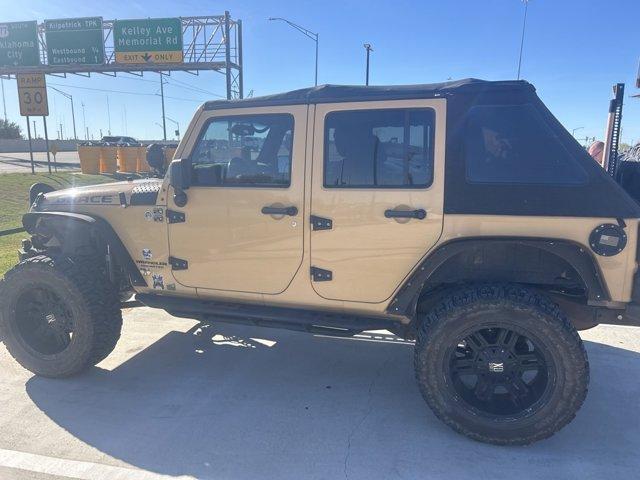 used 2014 Jeep Wrangler Unlimited car, priced at $17,474