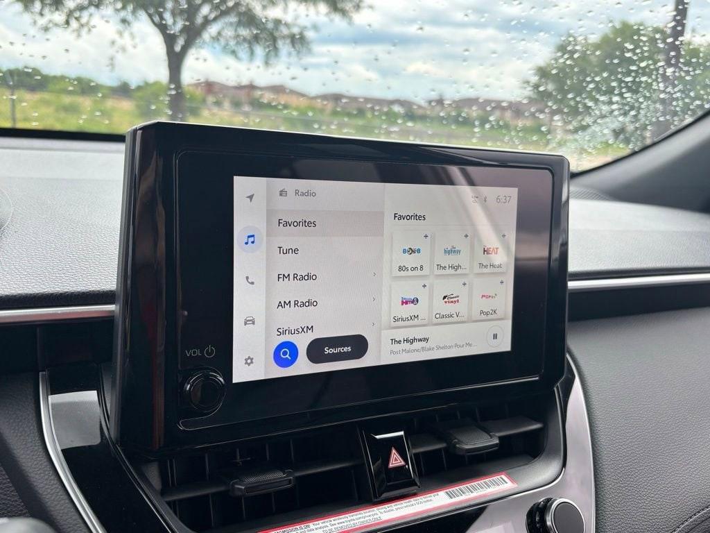 used 2023 Toyota Corolla Cross Hybrid car, priced at $30,972