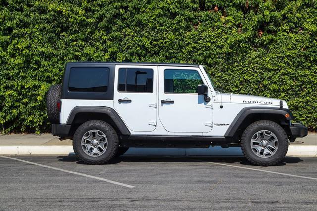 used 2015 Jeep Wrangler Unlimited car, priced at $17,389