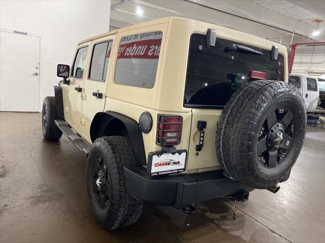 used 2011 Jeep Wrangler Unlimited car, priced at $16,499