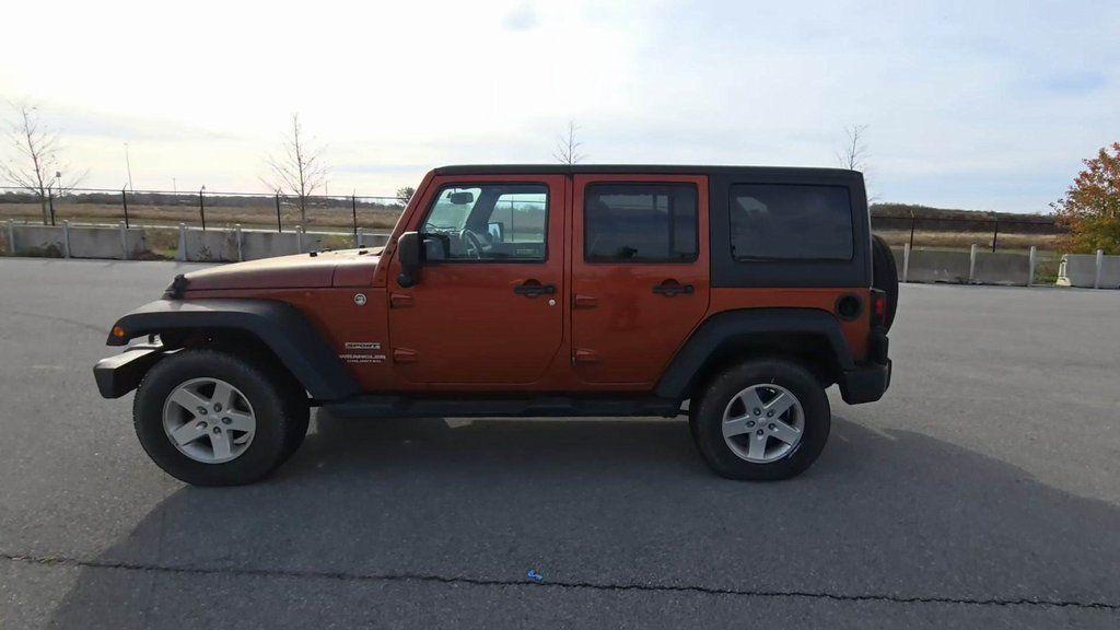 used 2014 Jeep Wrangler Unlimited car, priced at $18,148