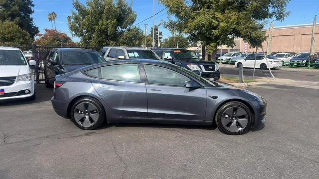 used 2023 Tesla Model 3 car, priced at $25,999