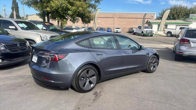 used 2023 Tesla Model 3 car, priced at $25,999