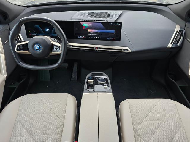 used 2024 BMW iX car, priced at $59,900