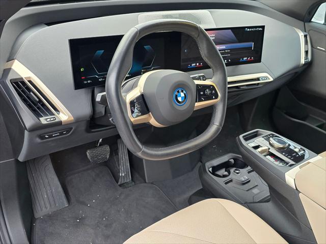 used 2024 BMW iX car, priced at $59,900